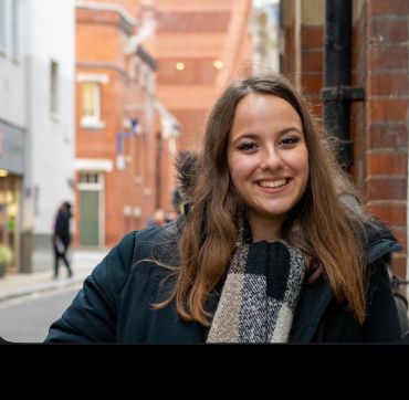 Emma Somos, a young white lady with light brown hair.