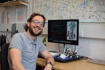 IOI DPhil student Wojtek Treyde at his desk at IOI