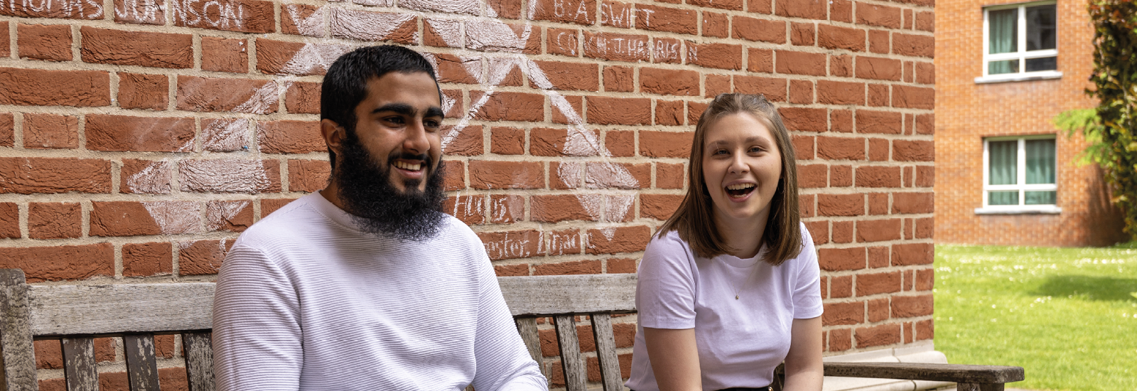 Two students sitting on a bench