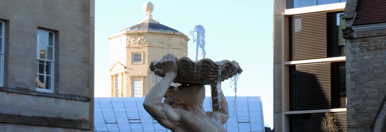 A water fountain with the Radcliffe Observatory Tower behind