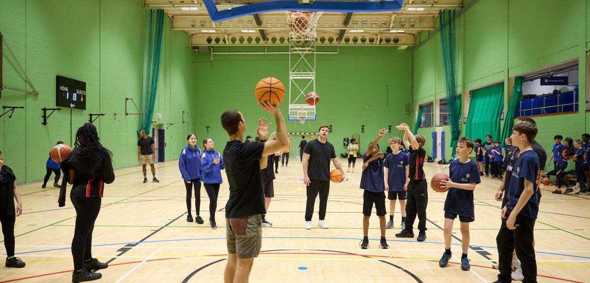 Image shows pupils enjoying a session of basketball with the Oxford Blues team