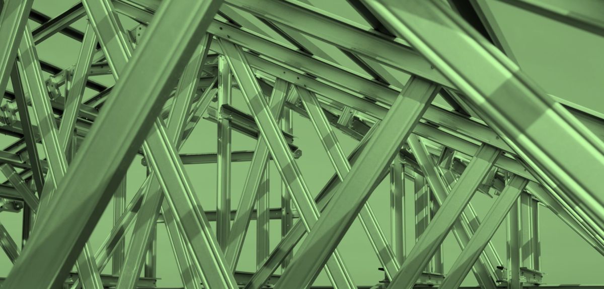 Structure of steel roof frame, with a green tint.