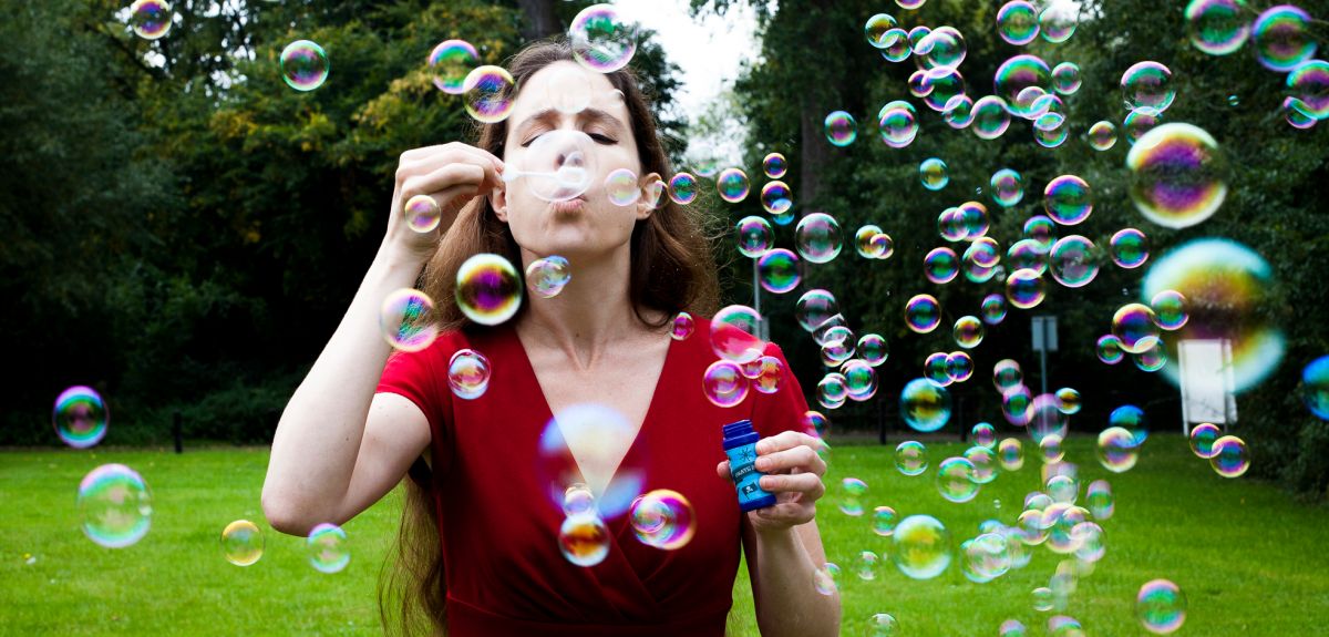 Eleanor Stride blowing soap bubbles