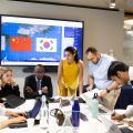 Students in the ROK (South Korea) nation room taking part in remote bilateral negotiations with students assigned to the China nation room